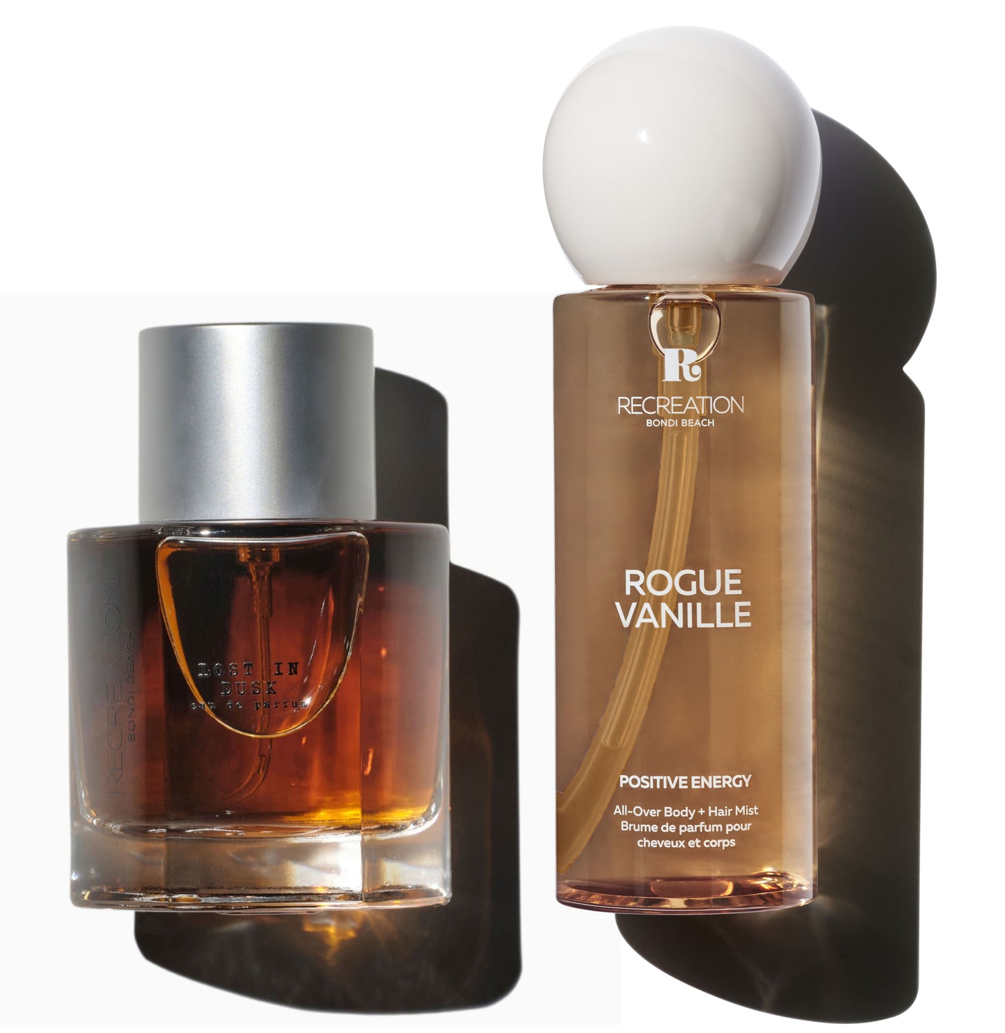 Two perfume bottles, one with a silver cap and the other labeled 'Rogue Vanille', on a white background.