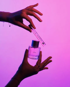 Close-up of L’Hotel eau de parfum packaging with warm vanilla amber scent profile