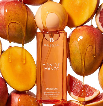 Tropical mango and coconut body mist bottle showcasing energising fragrance notes