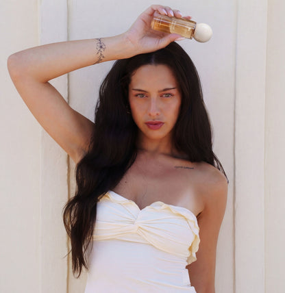 Rogue Vanille fragrance mist styled to represent uplifting vanilla scent and positive energy mood